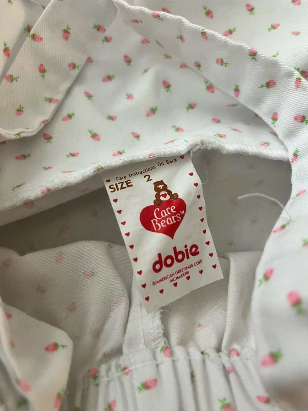 Vintage Care Bears White Overalls with Pink Floral Print and Pink Bear graphic